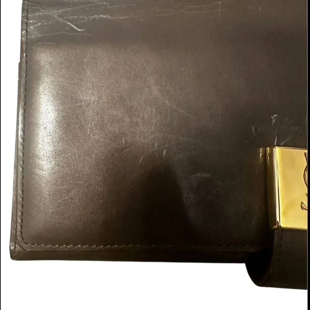 Yves Saint Laurent Tan Leather Wallet with Gold Clasp with marks and scratches.